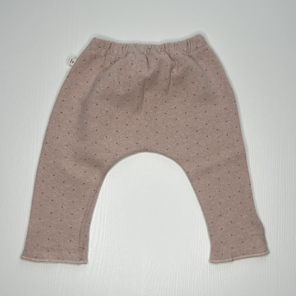 pantaloni morbidi neonati, pantaloni rosa micro fantasia, abbigliamento neonati comfort, pantaloni risvoltati neonato.