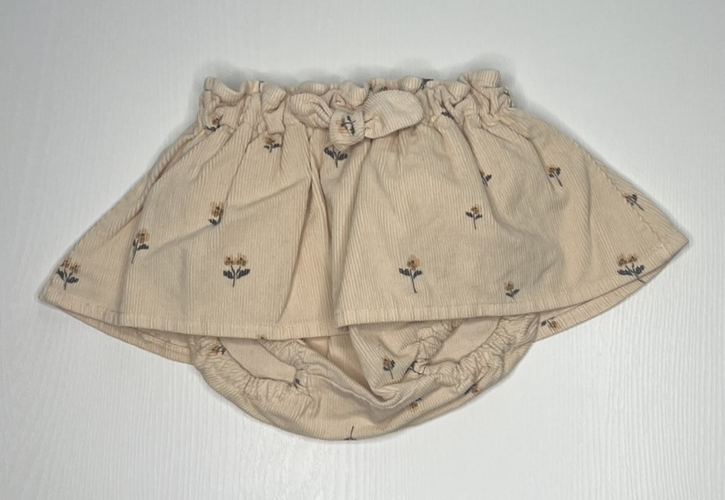 Gonna per bambina a costine in velluto bianca con elastico in vita.